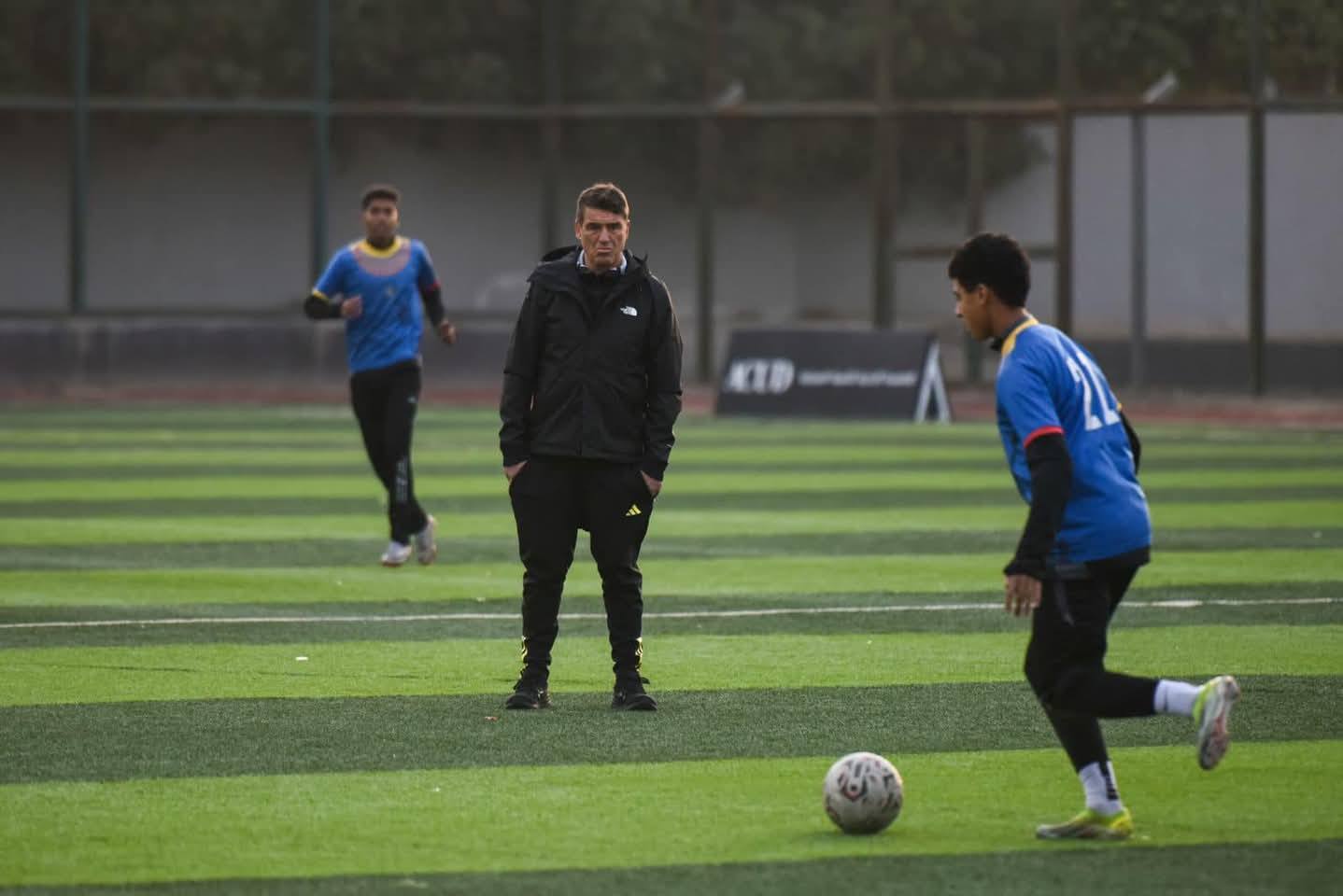 May be an image of 3 people, people playing football and people playing soccer